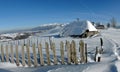 Winter landscape. Old stable in Pestera village, landmark attraction in Romania